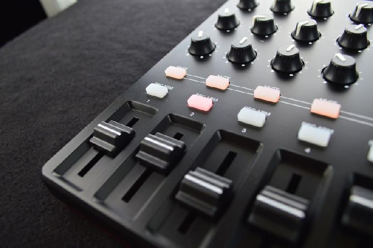 Close up of the faders and rotary encoders of the Akai Pro MIDImix