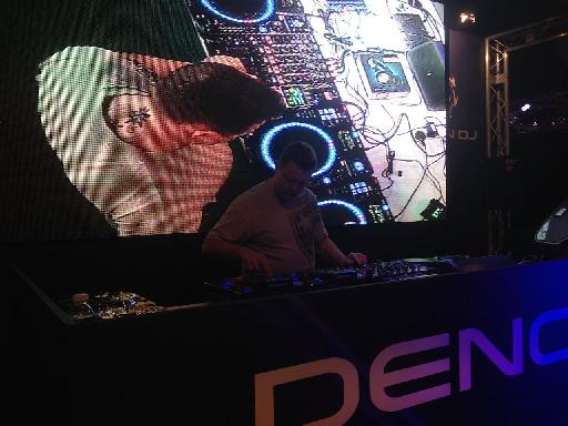 A DJ in action at the Denon DJ booth.
