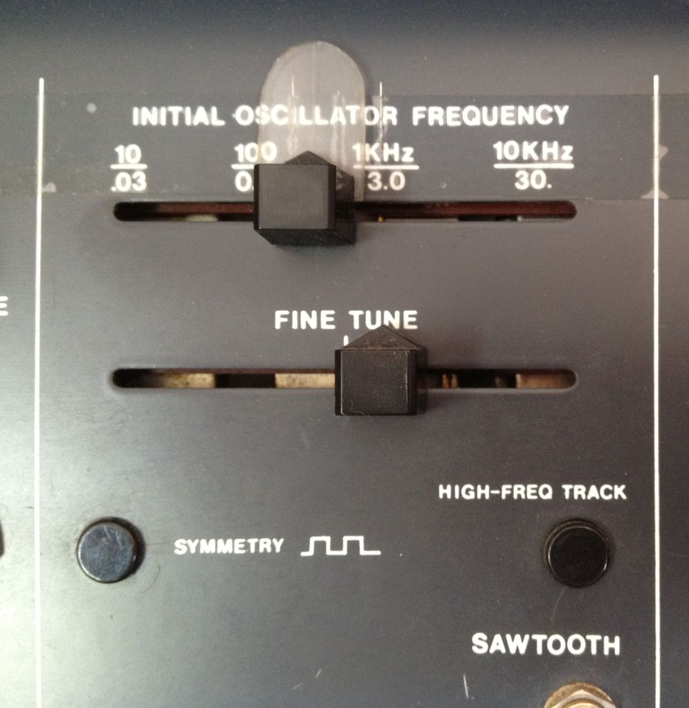 FIGURE 2: The Minimoog's frequency controls for oscillators 2 and 3 (large knobs) and their octave switches (which also control their frequency).