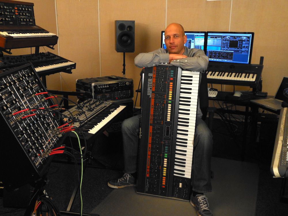 Rob Papen holds his Jupiter 8 protectively!