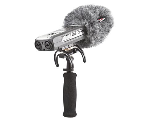 An external windshield like this model from Rycote will help to cut down any interference from the breeze.