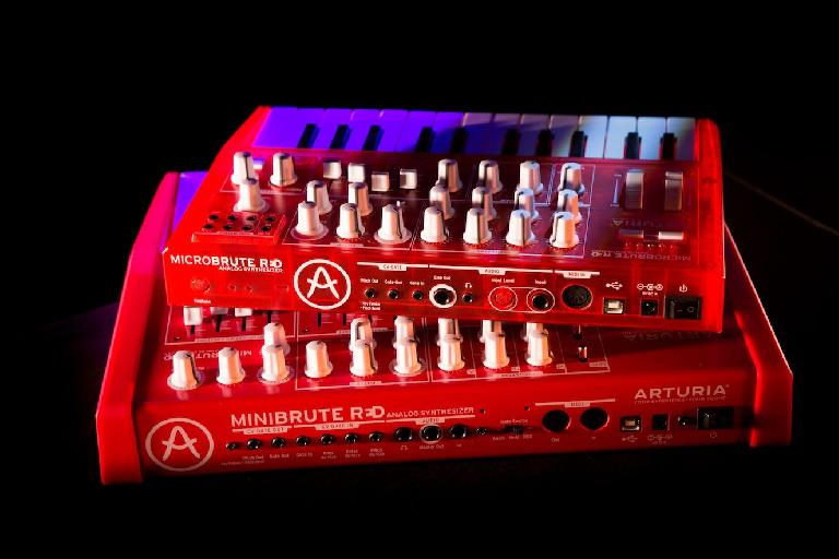 The MicroBrute RED straddling the MiniBrute.