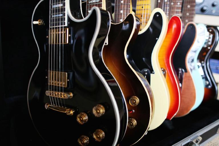 electric guitars in a rack