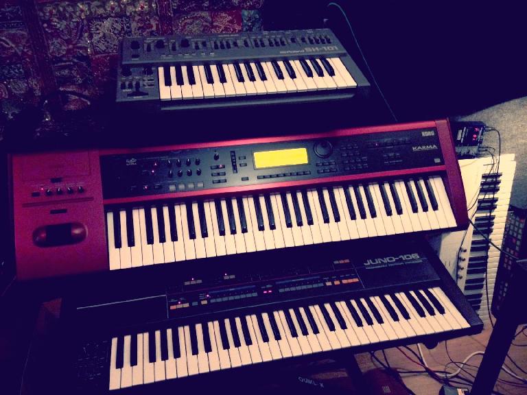 Kate's trusty Juno 106 under the Korg Karma and Roland SH-101