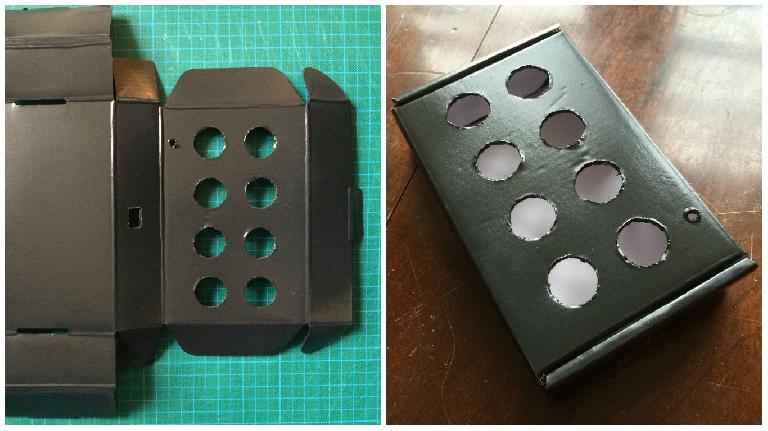My enclosure – a painted corrugated cardboard box with holes cut out for the buttons, switch, and USB port.
