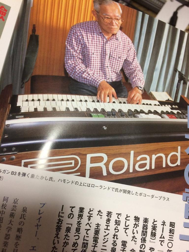 Noriyasu San playing a Roland synthesizer.