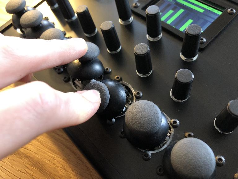 The thumb joysticks on the Turnado Hardware MIDI controller.