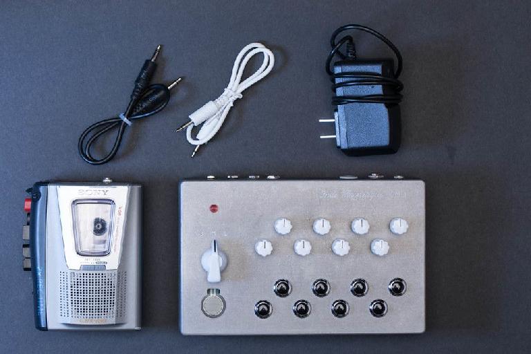 The OM-1 cassette synthesizer contents include a modified cassette player/recorder.