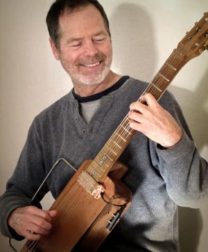 Bart Hopkins and his Floating Guitar instrument. Photo credit: childsplaymusic.com.au