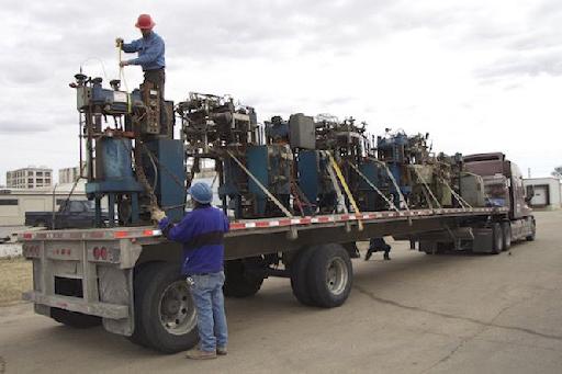 photo showing transportation of 13 vinyl presses.